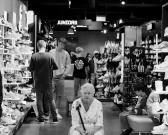 Peter Pickering sees an old lady waiting patiently inside a sports-shoe store