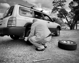 Man changing car wheel