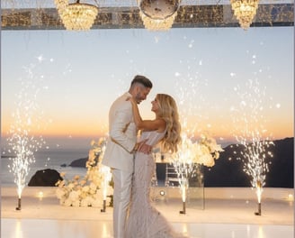 "Santorini wedding fireworks display for first dance, grand entrance, and wedding party celebration"