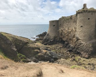 a castle like structure with a large stone wall