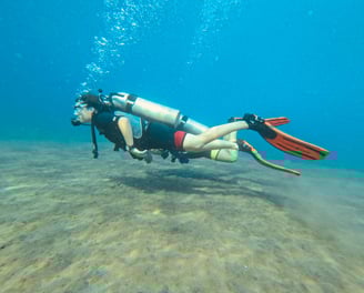 Female Scuba Diver underwater with perfect buoyancy