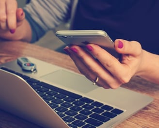 woman holding silver iPhone 6 mobile development