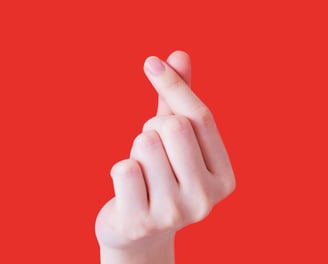 Hand forming a heart shape
