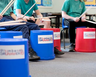 Group of young people bucket drumming