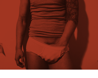 Toronto Gay Escort & Nude Male Massage by Nick Rivera | A red filtered photo of Nick in white briefs