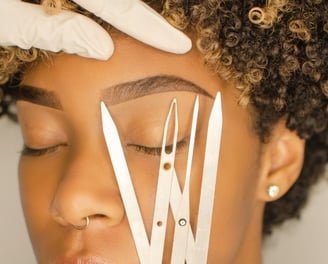 a woman with a pair of scissors and a pair of scissors