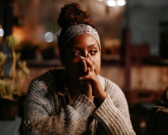 a woman with a headband and a headband on her hands