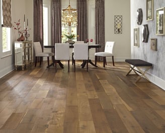 Beautifully finished hardwood floor in an elegant dining room, with a warm, medium toned wood.
