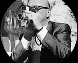 a man in a suit and tie is taking a picture