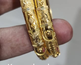 a pair of gold plated bangles