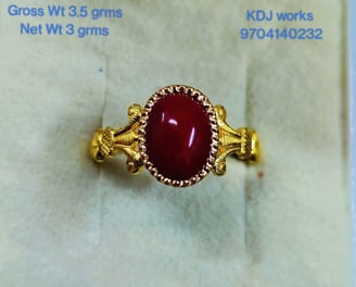 a ring with a red stone ring on it