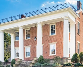 a large brick building with columns and columns