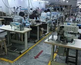 Advanced automated machinery producing high-performance tactical uniforms.