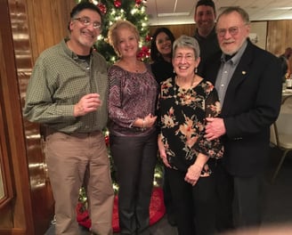 Smiling neighbors at the Crescent Hills holiday party