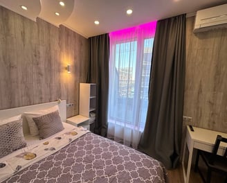a bed room with a bed and a desk