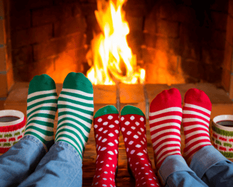a couple of feet in socks with christmas stockings