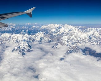 The tallest mountains in the Himalayan Mountain Range, with Mt. Everest. The view from the airplane