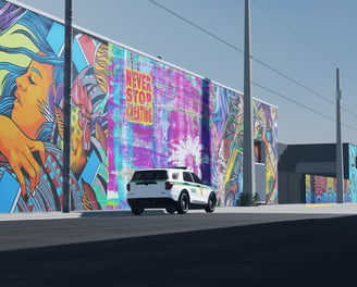 a van parked in front of a colorful mural of a mural of a woman