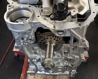 a car engine with a small engine in a garage
