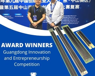 a man and woman standing in front of a blue and white banner