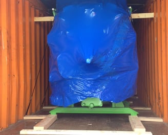 a large container with a blue covered product