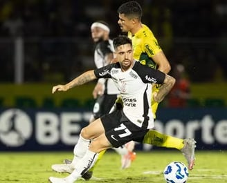 a soccer player is playing soccer on a field