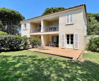 a house with a deck and decking area