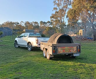 car with an oven pizza trailer