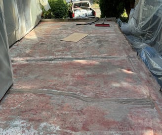 1930's Concrete paint and sealer that has chipped and failed to hold water out of the garage below.