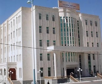 a large white building with a large white building in the background