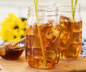 a couple of mason jars filled with iced tea