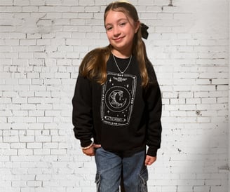 girl in a tarot design black embroidered sweatshirt 