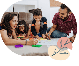 a family with young children playing with toys - happy