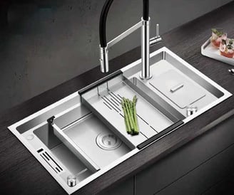 a handmade kitchen sink with strainer and interior sink
