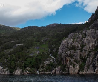 small waterfall at the side of the fjord