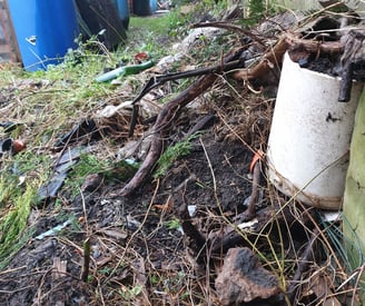 a trash pile in an allotment garden