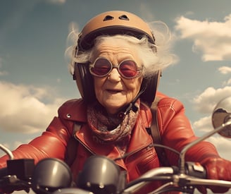 Old woman dressed in a red leather jacket and riding a motorbike.