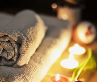 a towel towel on a table with candles and candles