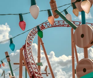 a roller coaster coasterer with a roller coasterer in the background