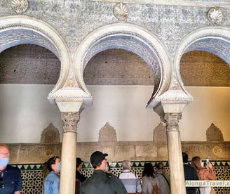complicated latticework over a triple archway in Mudejar style building
