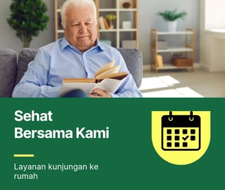 a man sitting on a couch with a book
