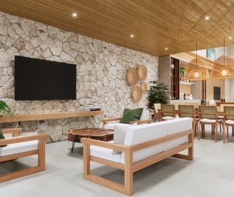 living com parede em pedra e decoração em fibra natural de uma consultoria de interiores