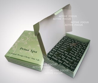 a box of printed paper with printed essential oil holder inside