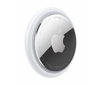a round mirror with a white apple logo