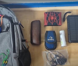 Grey Backpack With Blue Bag, Facemask, Glasses Case, Wallet, Inhaler, Batteries, and Kindle