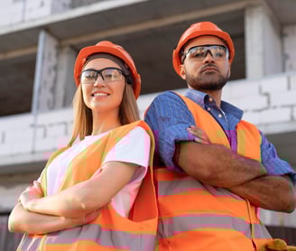 a man and woman in orange safety vests and safety vests