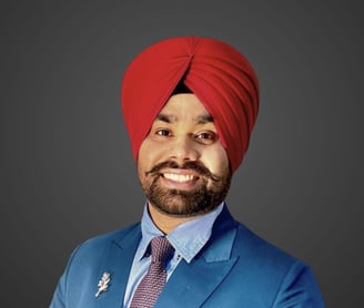 a man in a red turban wearing a blue suit