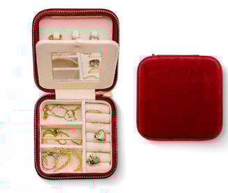 a red velvet case with jewelry inside
