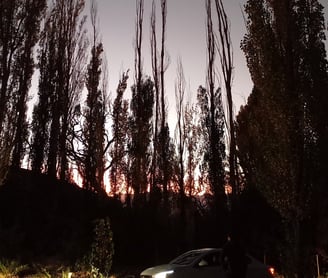 a car parked in a driveway with a car parked in front of it