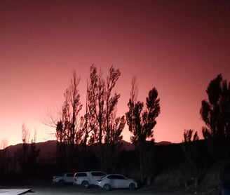 a car parked in a parking lot at night